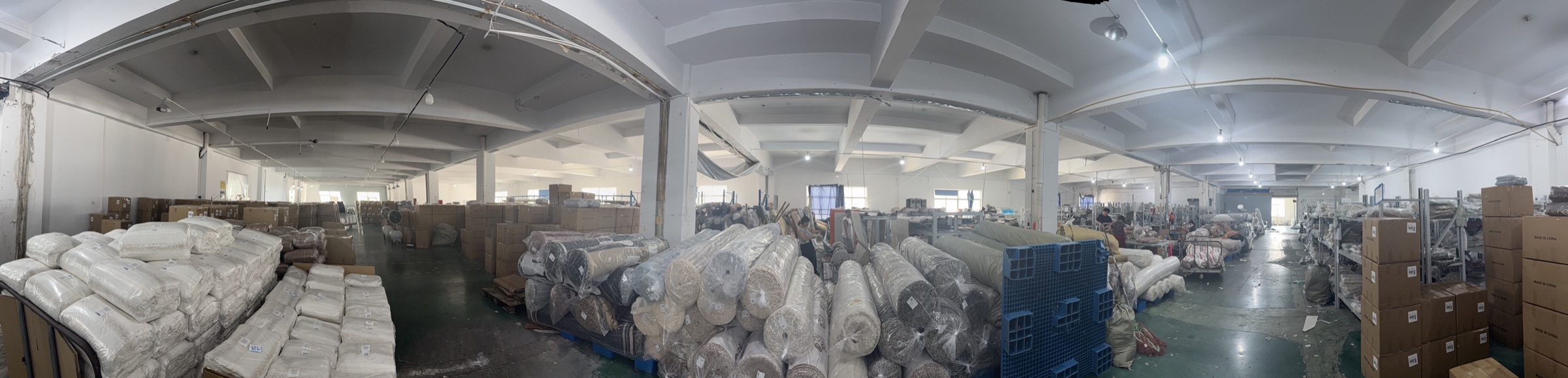 Wide view of BOYA textile roll and finished-goods storage