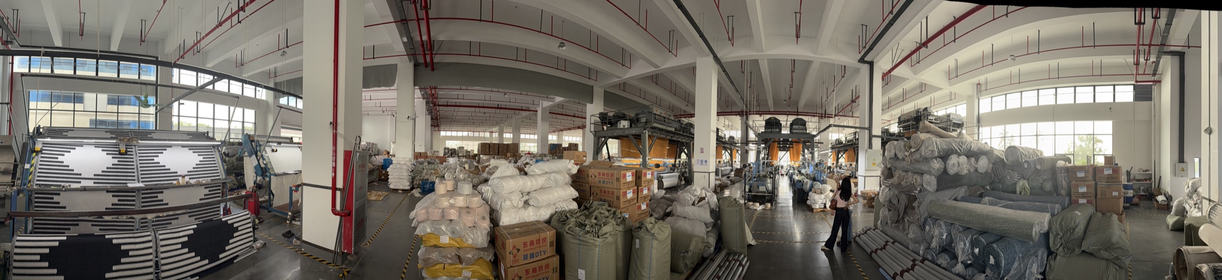 BOYA production floor with textile rolls and operating equipment